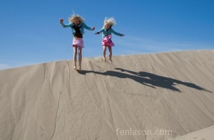 Alyssa & Carlye jumping off the dunes!
