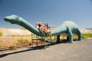 More roadside dinosaurs in front of closed storefront