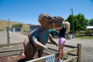 Carlye kissing the Dinosaur Colorado dinosaur