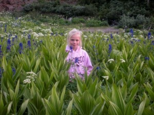 Carlye enjoying the flowers in the basin