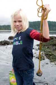 Carlye holding an intersting plantlife attahced to a rock