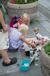 Alyssa & Carlye look at dogs begging for money (or food)